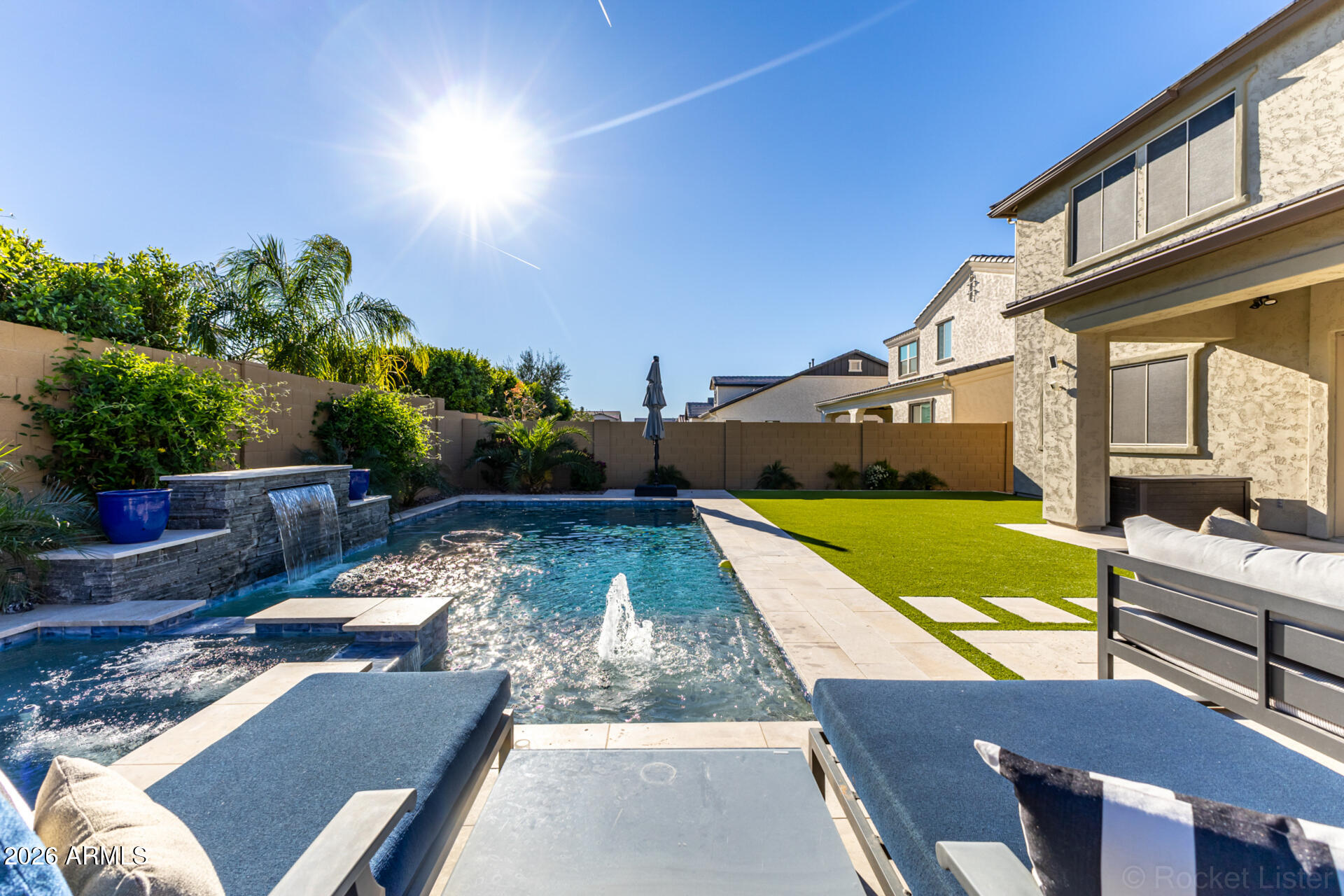 2285 East Athena Avenue Gilbert, AZ 85297 - Photo 56 of 58 a view of a patio with couches table and chairs with potted plants