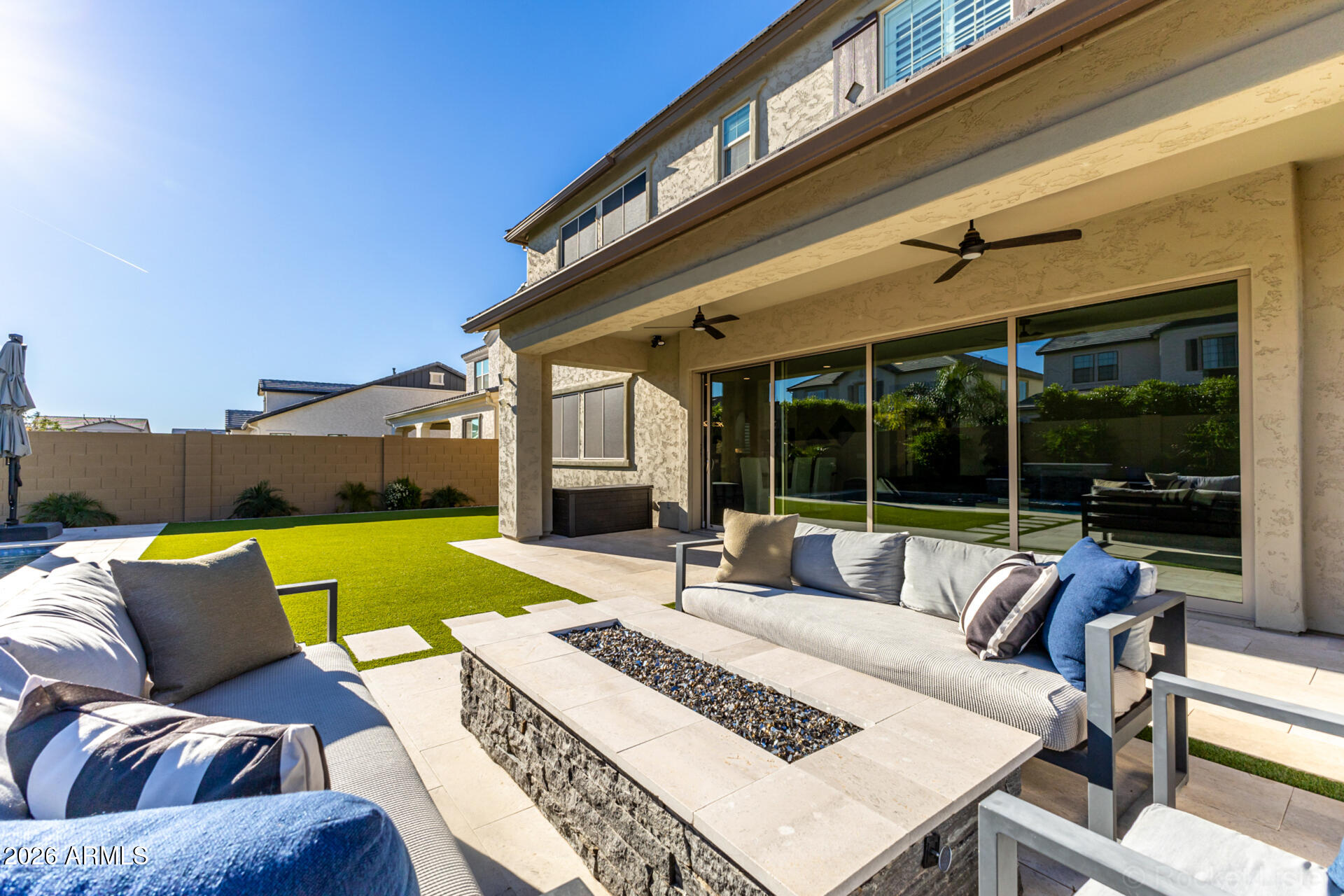 2285 East Athena Avenue Gilbert, AZ 85297 - Photo 57 of 58 a view of a patio with couches chairs and a table and chairs