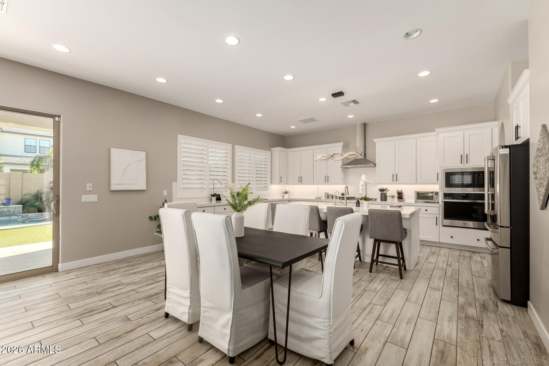 2285 East Athena Avenue Gilbert, AZ 85297 - Photo 8 of 58 a view of kitchen with cabinets and wooden floor