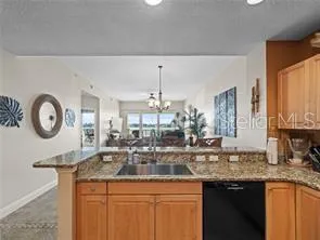 a bathroom with a granite countertop sink a large mirror and vanity