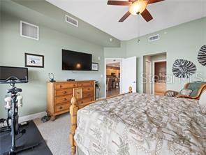 17735 Gulf Boulevard, Unit 204 Redington Shores, FL 33708 - Photo 17 of 23 a bedroom with a bed and a flat screen tv