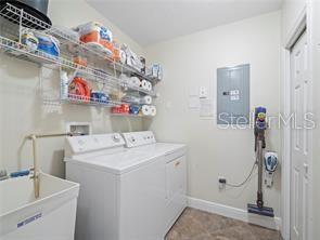 17735 Gulf Boulevard, Unit 204 Redington Shores, FL 33708 - Photo 21 of 23 a utility room with dryer and washer
