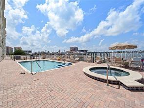 17735 Gulf Boulevard, Unit 204 Redington Shores, FL 33708 - Photo 23 of 23 a view of a swimming pool with a lounge chair
