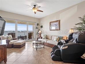 17735 Gulf Boulevard, Unit 204 Redington Shores, FL 33708 - Photo 8 of 23 a living room with furniture and a large window