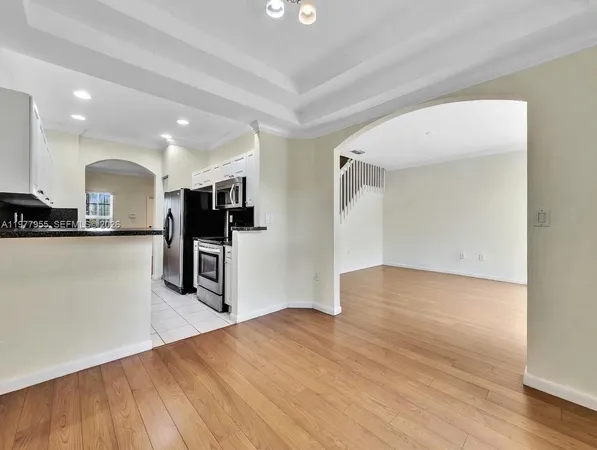 a view of kitchen with wooden floor
