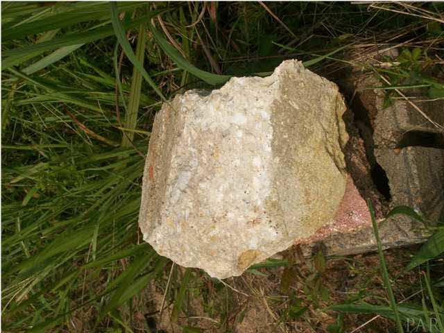 3825 Lewis Road Milton, FL 32570 - Photo 5 of 15 This photos is sideways. You are looking at a rocki on top of the 4" well opening, 68' deep.