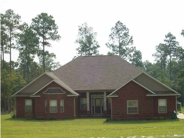 3825 Lewis Road Milton, FL 32570 - Photo 9 of 15 You could build a home like this, and even add a barn. This one is on the way to the Forest where you ride down the road to enter.