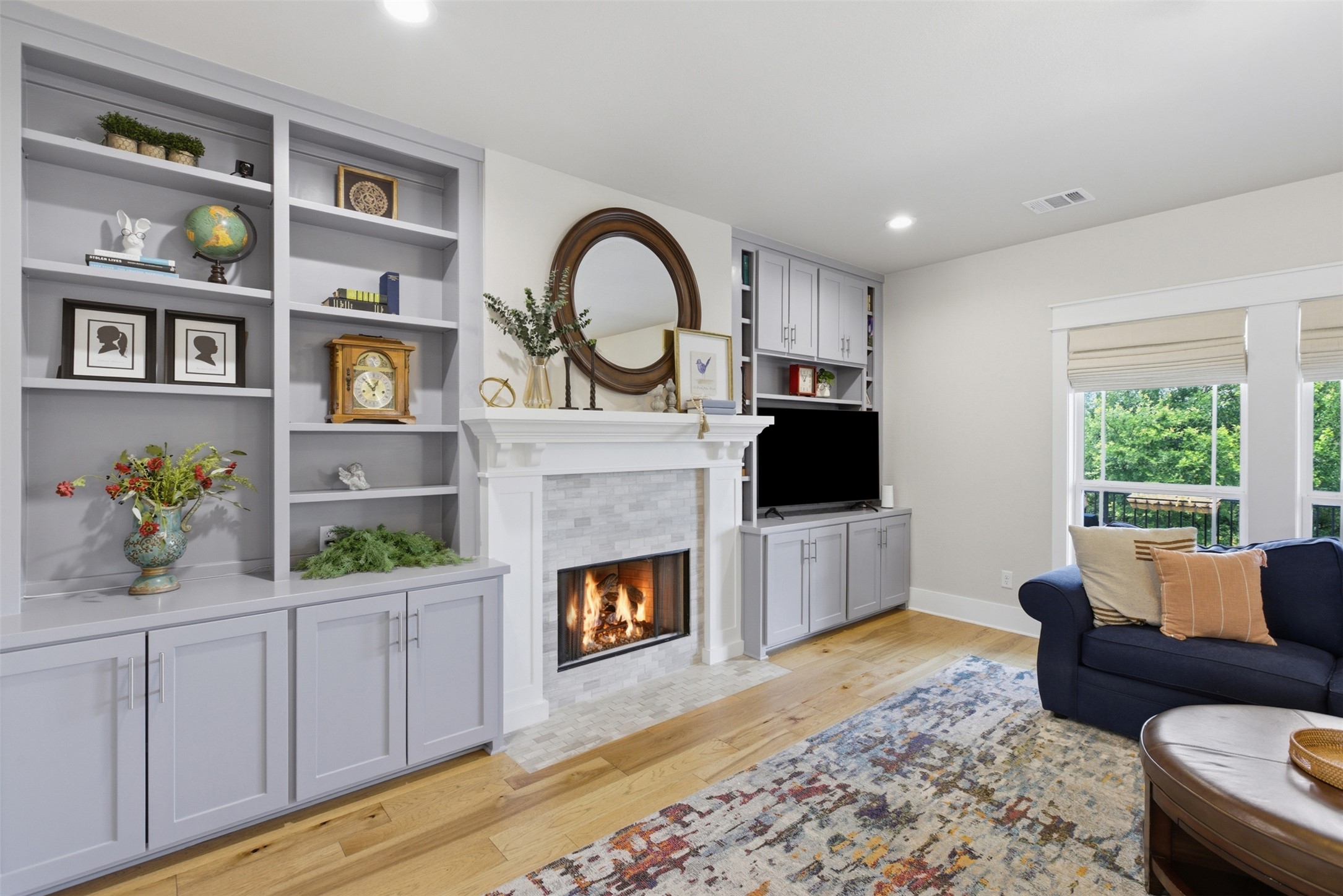 1804 Tanner Loop Taylor, TX 76574 - Photo 4 of 40 Built-in bookcases frame the fireplace for functionality and a stylish touch.