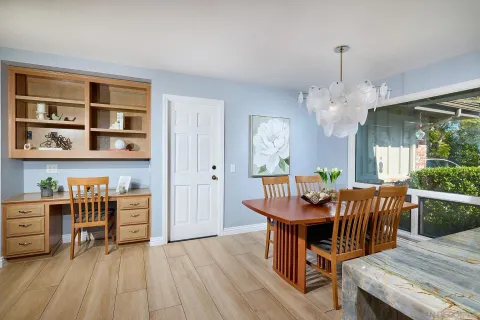 a kitchen with stainless steel appliances granite countertop a stove and white cabinets
