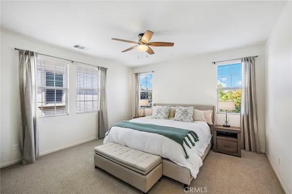 a bedroom with a bed and window