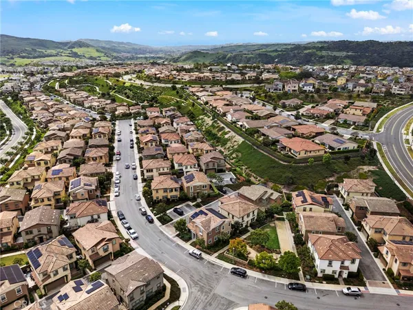 an aerial view of residential houses with outdoor space