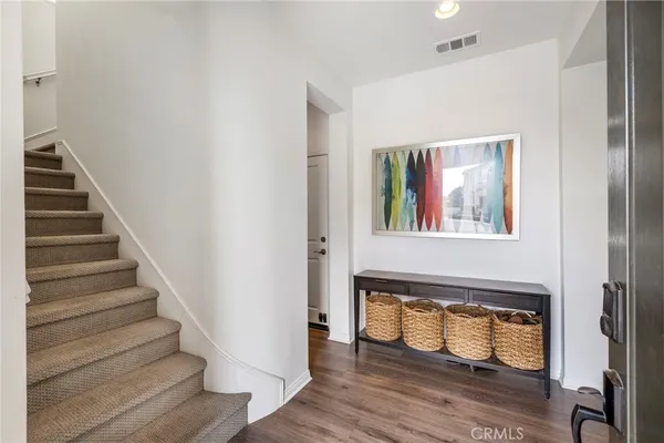 a view of an entryway with wooden floor