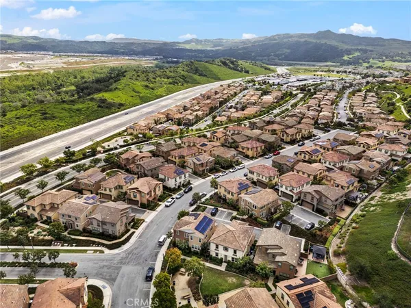 an aerial view of residential building and ocean view