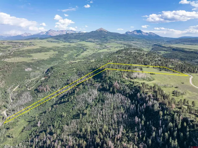 a view of a city with mountains in the background