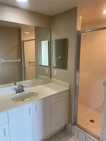 a bathroom with a sink a mirror and a toilet