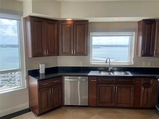 a kitchen with a sink stove and refrigerator