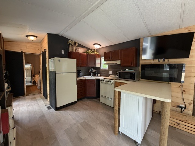 2795 East 28th Road Marseilles, IL 61341 - Photo 8 of 58 a kitchen with a refrigerator a microwave a sink and cabinets