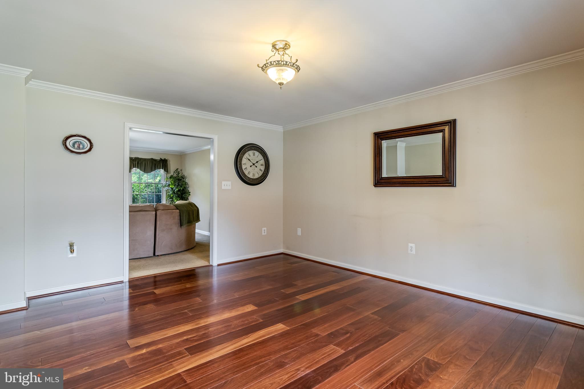 203 Morgans Ridge Court La Plata, MD 20646 - Photo 36 of 59 a view of an empty room with wooden floor and a window