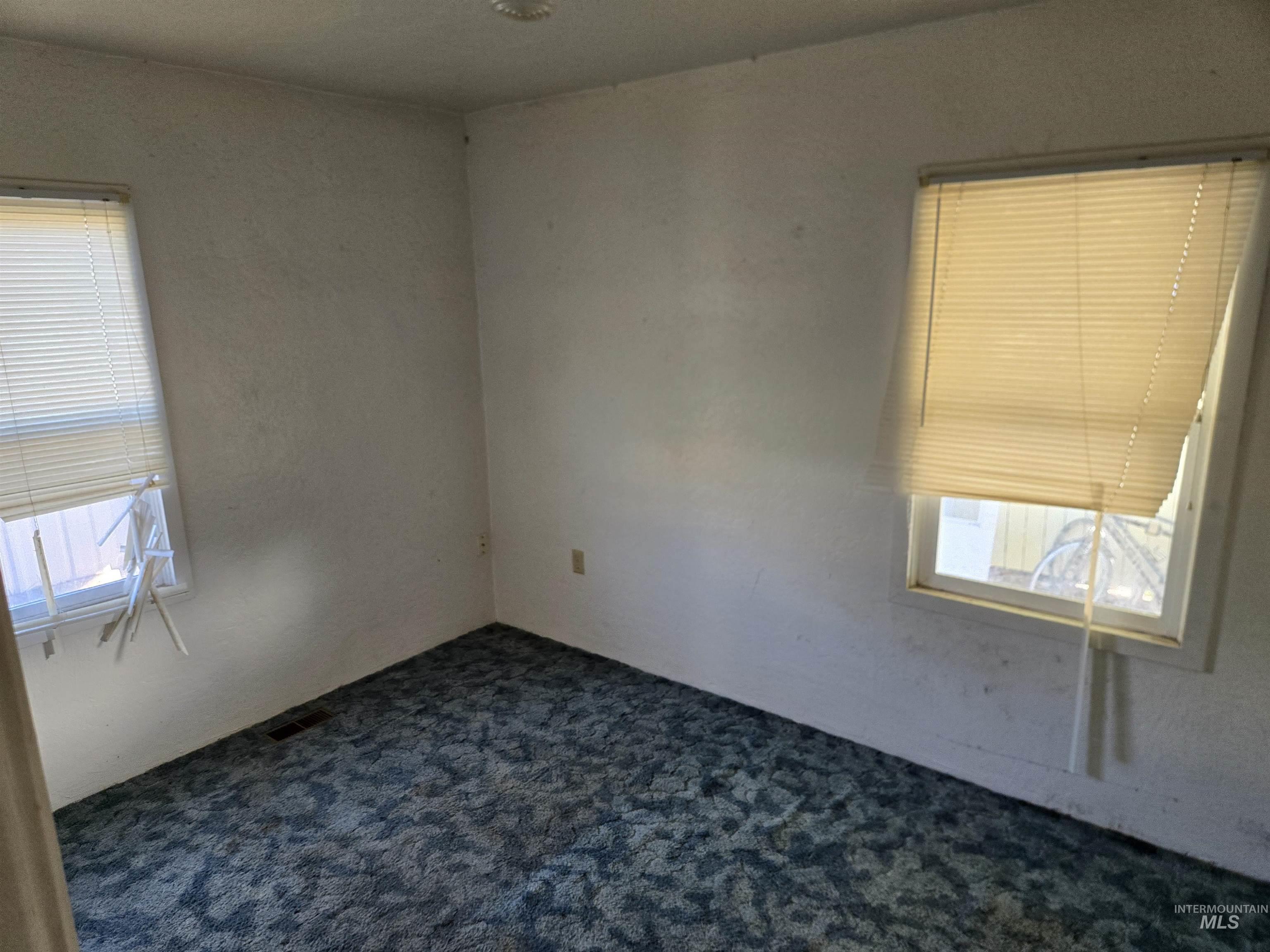 619 Thain Road Lewiston, ID 83501 - Photo 6 of 14 Spare room featuring dark carpet