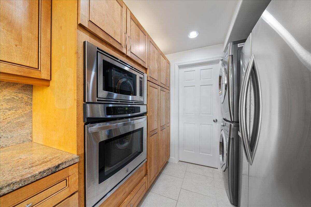 2220 Front Street, Unit 402 Melbourne, FL 32901 - Photo 12 of 26 a kitchen with a stove microwave and refrigerator