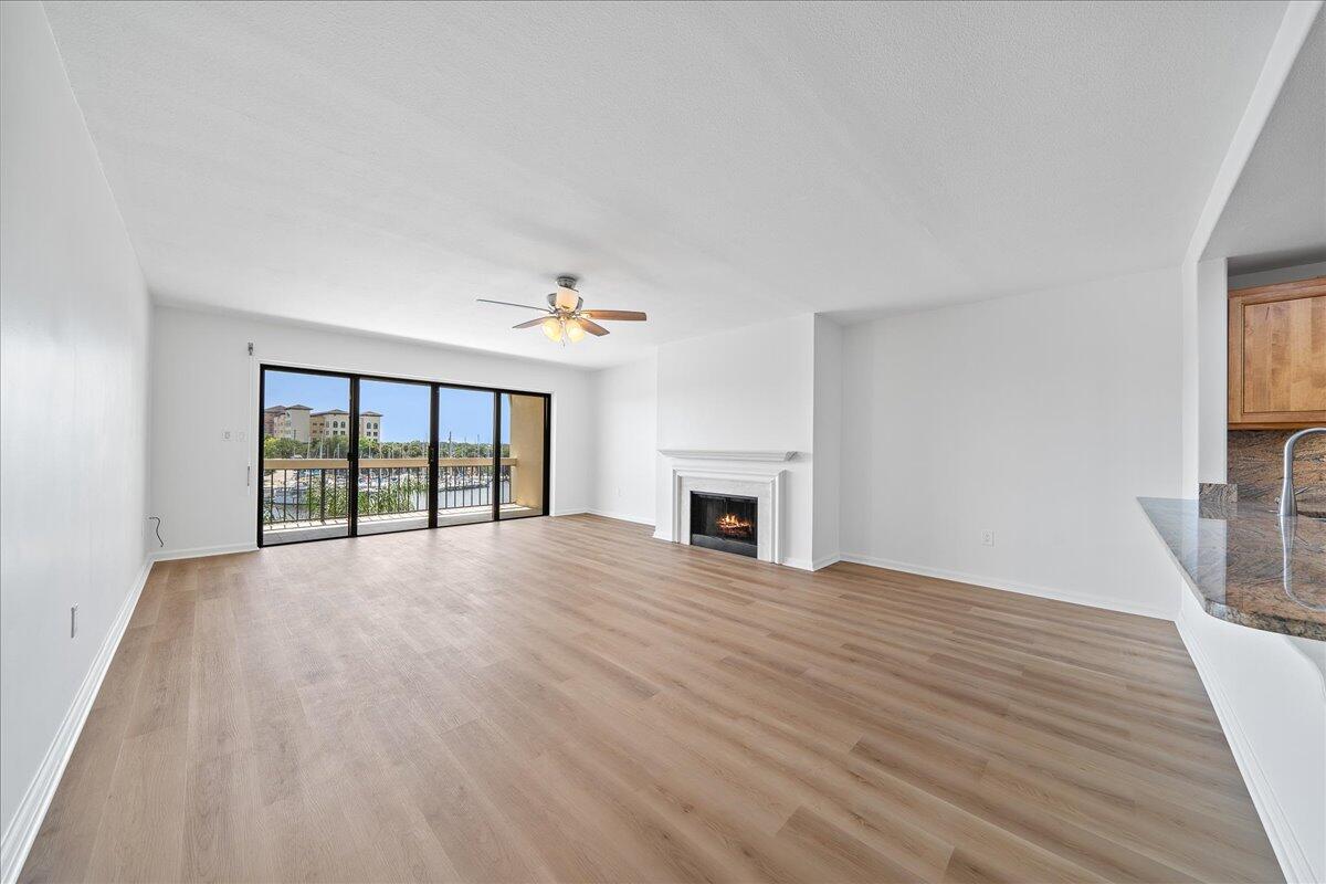 2220 Front Street, Unit 402 Melbourne, FL 32901 - Photo 14 of 26 a view of an empty room with wooden floor and a window