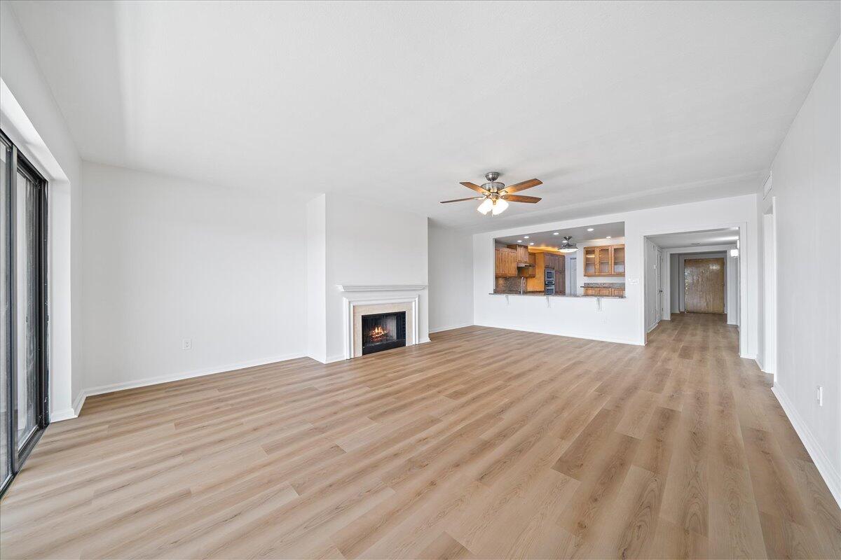 2220 Front Street, Unit 402 Melbourne, FL 32901 - Photo 16 of 26 a view of empty room with wooden floor and fireplace
