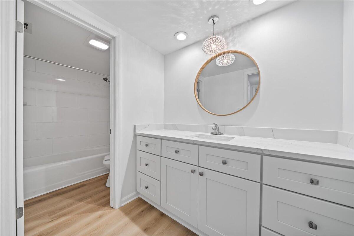 2220 Front Street, Unit 402 Melbourne, FL 32901 - Photo 19 of 26 a bathroom with a double vanity sink and a mirror