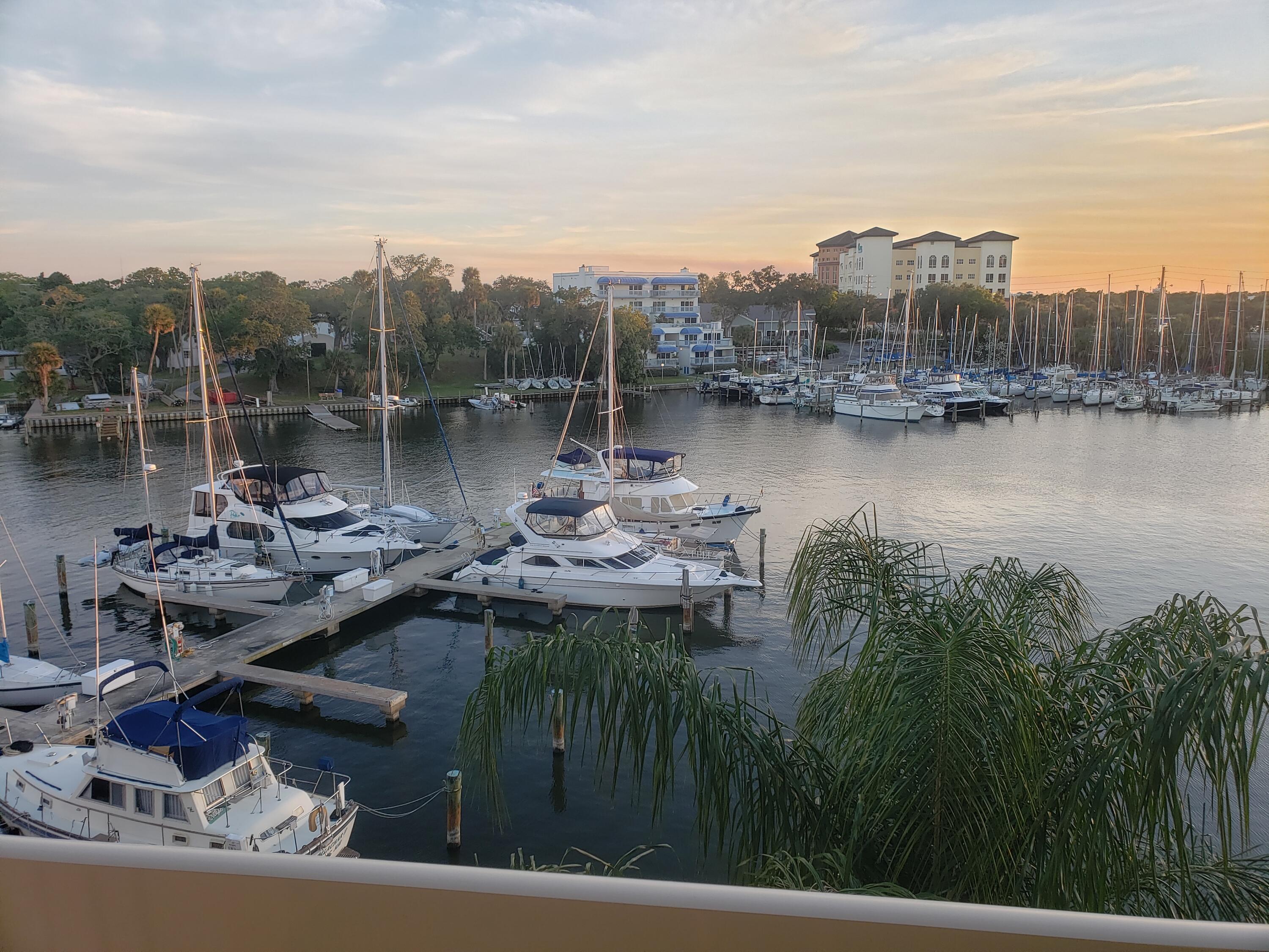 2220 Front Street, Unit 402 Melbourne, FL 32901 - Photo 2 of 26 a view of a lake with a city
