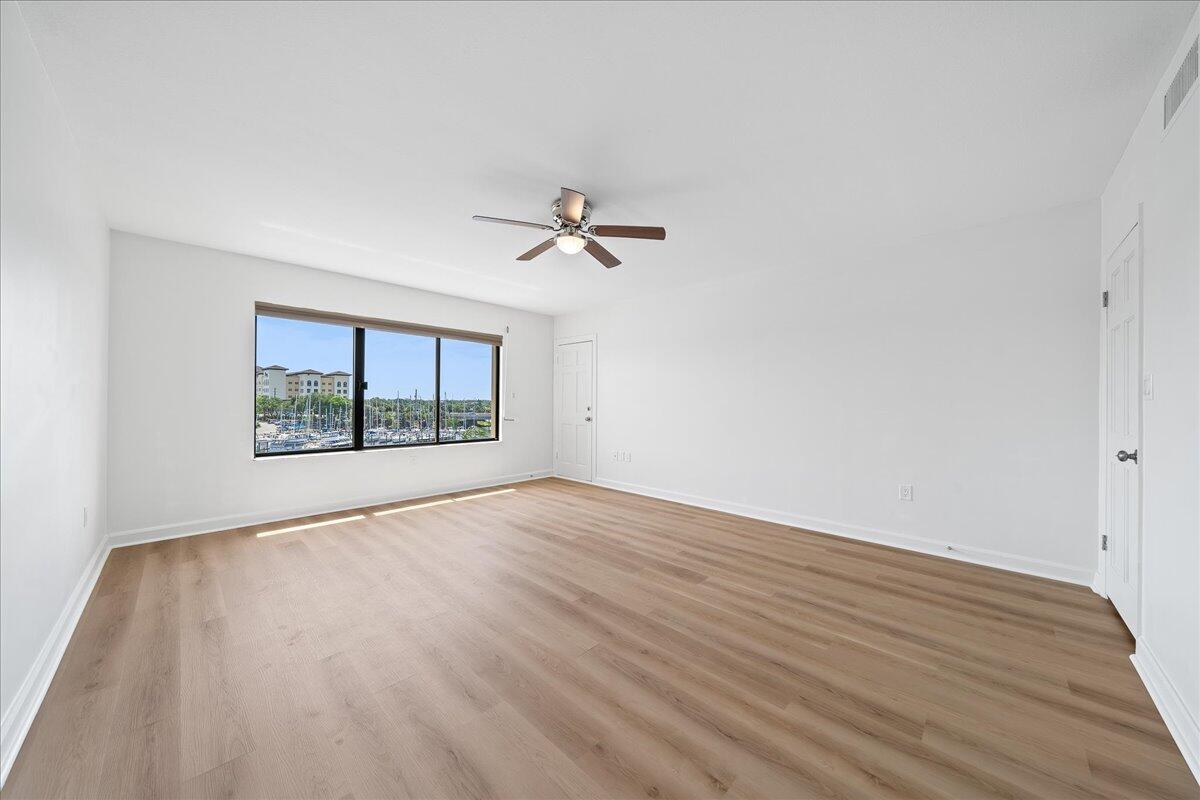 2220 Front Street, Unit 402 Melbourne, FL 32901 - Photo 21 of 26 wooden floor in an empty room with a window
