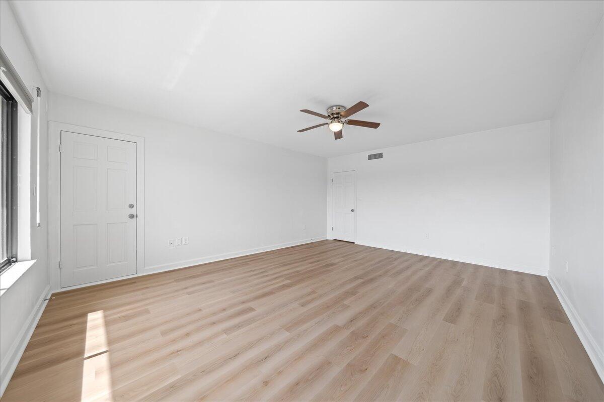 2220 Front Street, Unit 402 Melbourne, FL 32901 - Photo 22 of 26 wooden floor in an empty room