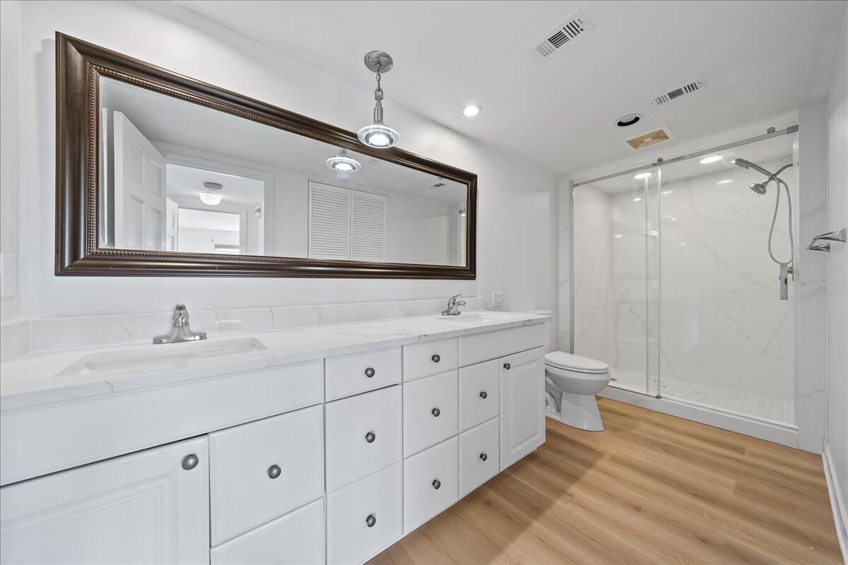 2220 Front Street, Unit 402 Melbourne, FL 32901 - Photo 23 of 26 a bathroom with double sink and a mirror