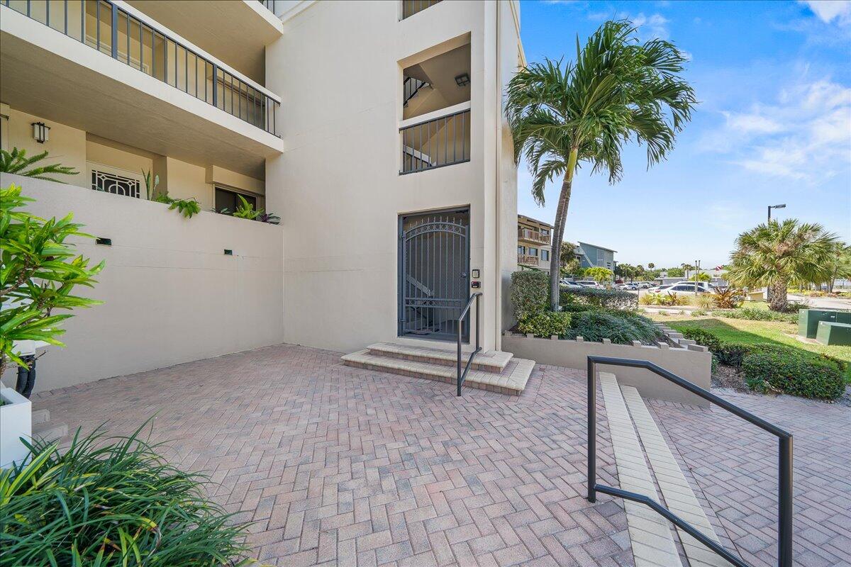 2220 Front Street, Unit 402 Melbourne, FL 32901 - Photo 24 of 26 a view of a terrace with a bench