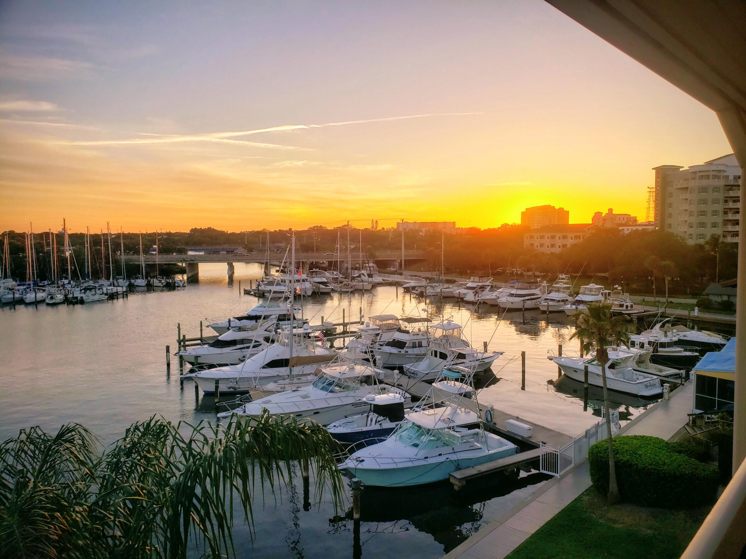 2220 Front Street, Unit 402 Melbourne, FL 32901 - Photo 3 of 26 a view of a lake with couches and city view