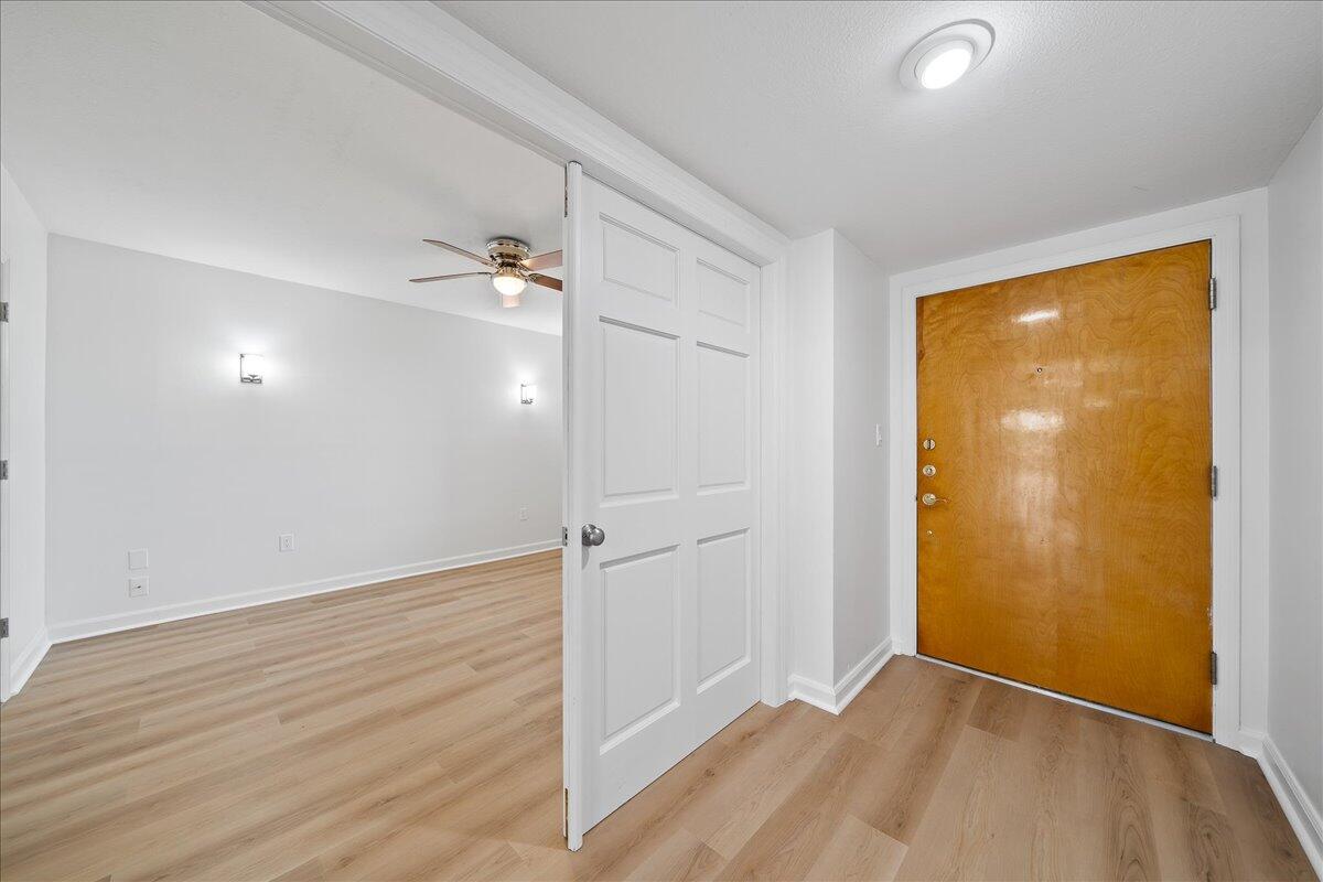 2220 Front Street, Unit 402 Melbourne, FL 32901 - Photo 6 of 26 a view of an empty room with wooden floor and a window