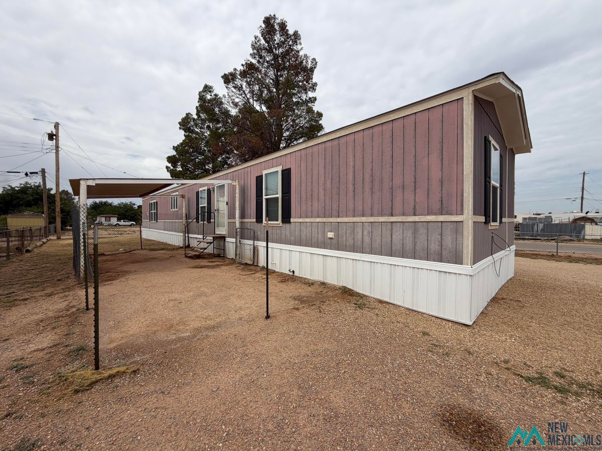 801 Riata Road Carlsbad, NM 88220 - Photo 37 of 39 Exterior features board and batten siding with white trim