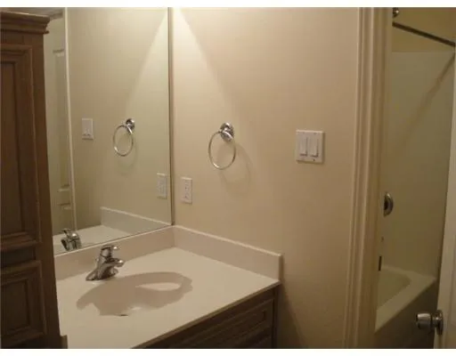 a bathroom with a sink and mirror