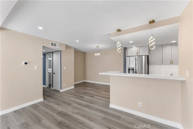 a view of kitchen with wooden floor