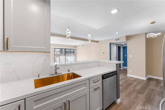 a kitchen with a sink and cabinets