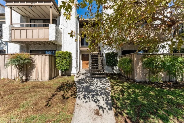 a view of a house with a tree