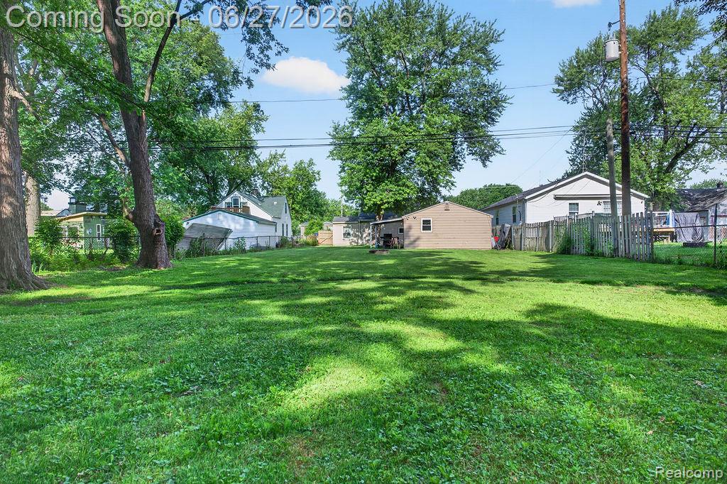 7715 Beech Daly Road Taylor, MI 48180 - Photo 6 of 21 Expansive green lawn with mature shade trees and partial fencing