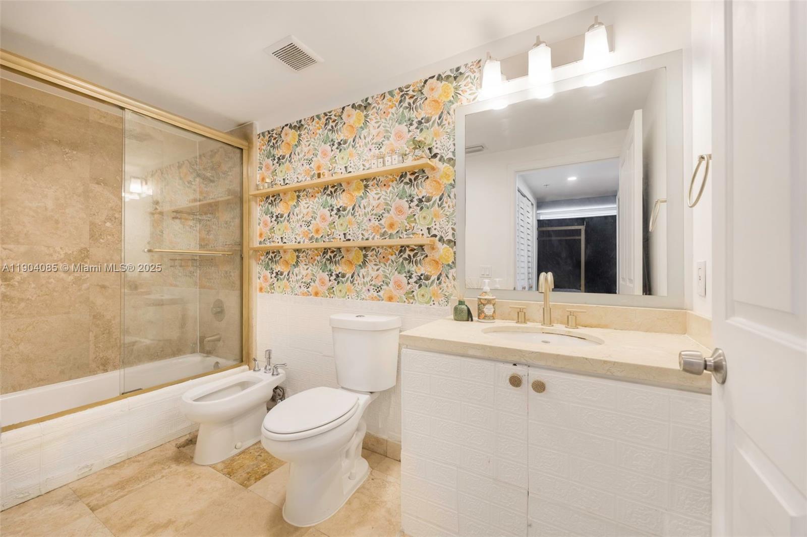 2650 Southwest 37th Avenue, Unit 801 Miami, FL 33134 - Photo 14 of 23 a bathroom with a sink a toilet and shower