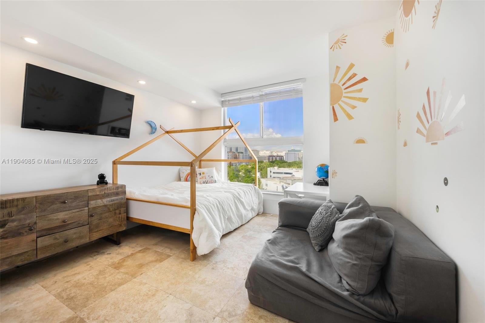 2650 Southwest 37th Avenue, Unit 801 Miami, FL 33134 - Photo 15 of 23 a bedroom with furniture and a flat screen tv