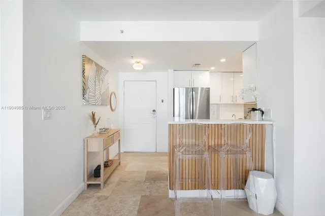 a view of kitchen with furniture and wooden floor