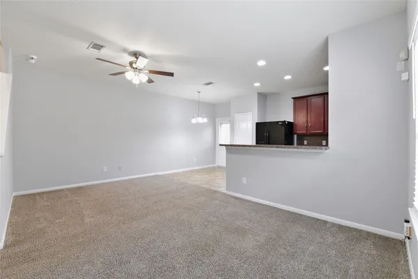a view of a kitchen with electric appliances