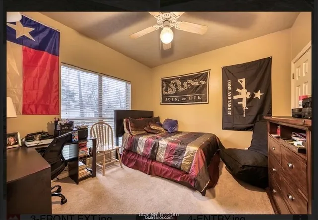 a bedroom with bed and window