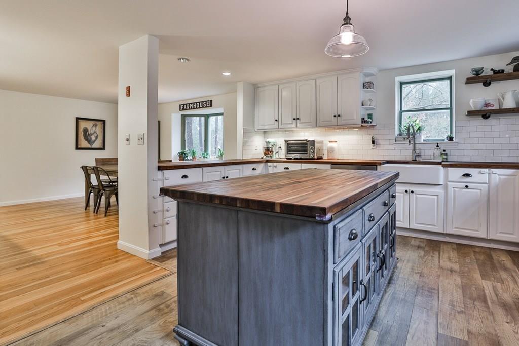 126 West Bare Hill Road Harvard, MA 01451 - Photo 5 of 37 a kitchen with a stove sink and cabinets