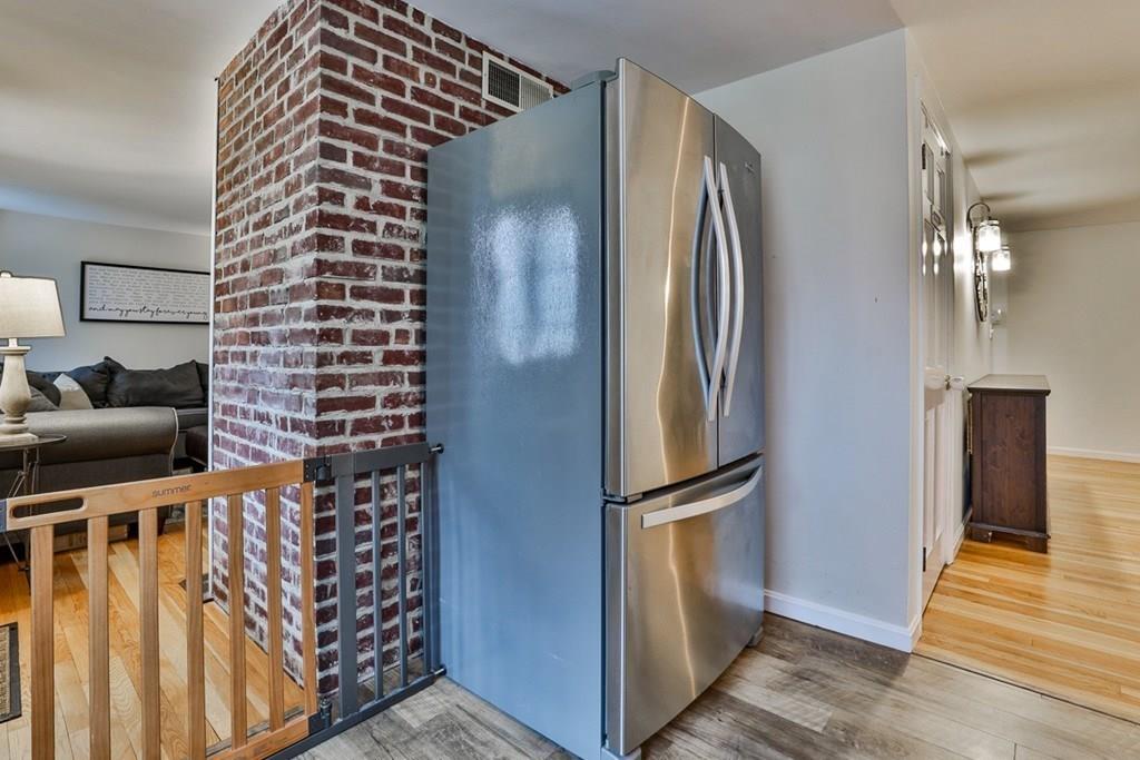 126 West Bare Hill Road Harvard, MA 01451 - Photo 6 of 37 a view of hallway with furniture and a refrigerator