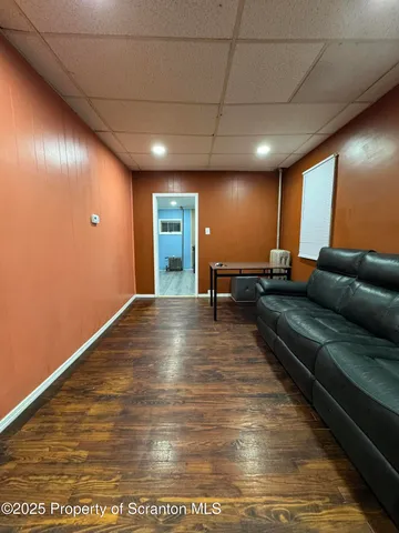 a view of a livingroom with furniture and a rug