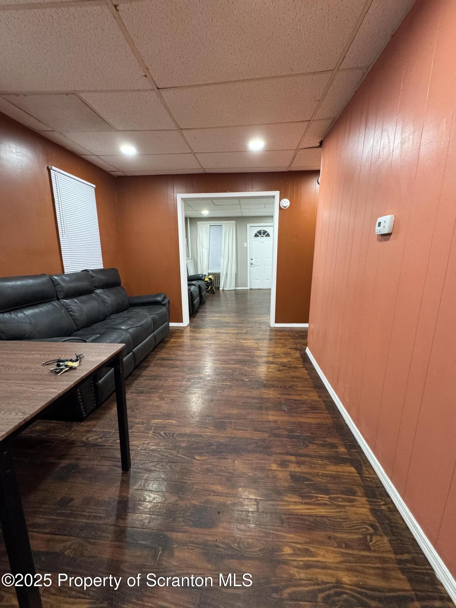 618 Deacon Street Scranton, PA 18509 - Photo 6 of 12 a view of a hallway with wooden floor
