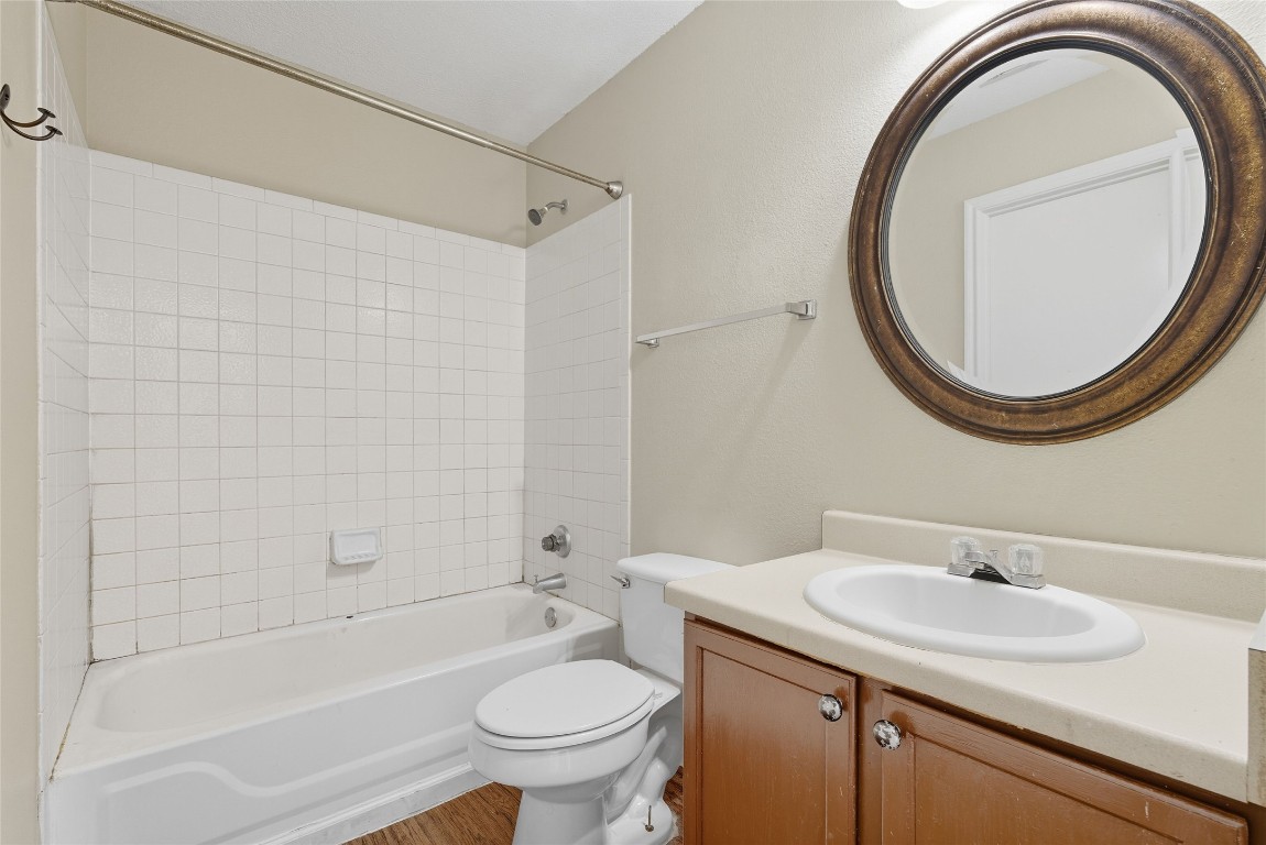3621 Walleye Way Round Rock, TX 78665 - Photo 10 of 14 Bathroom featuring bathing tub / shower combination and vanity